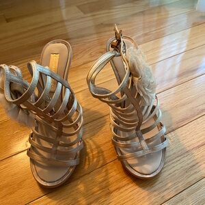 BCBGMaxAzria Gold Strappy Heeled Sandals with Floral Accent